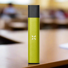 pax era life pod vaporizer on desk in grass colour