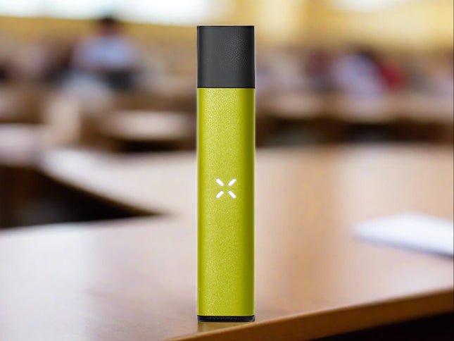 pax era life pod vaporizer on desk in grass colour