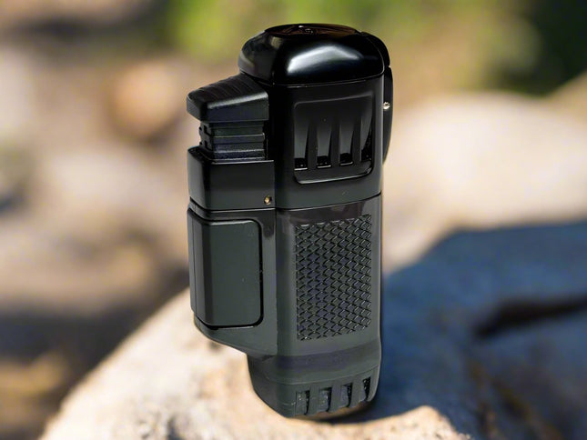 vector quadtank 4-flame lighter with dust cover closed on rock