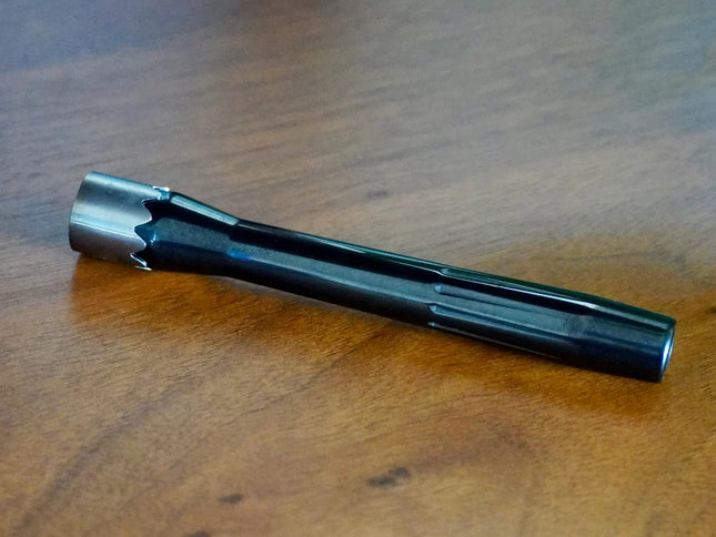 Ceramo XL vaporizer in black zirconia, disassembled to show stem, cap, and chamber components.