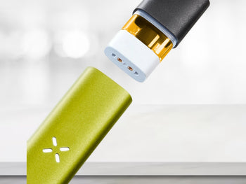 pax era life pod vaporizer with a pod not included being inserted