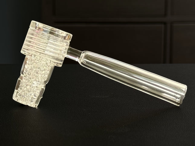 Close-up of the Vapvana Natural showing clear glass and densely packed quartz balls.