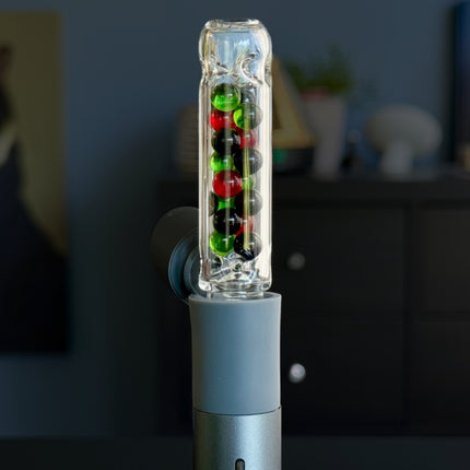 Close-up of Evolution Stem on Puffco Pivot, highlighting internal multicolour bead cooling system