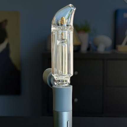 Puffco Pivot with curved BubbleStem installed, showing compact water chamber and angled mouthpiece