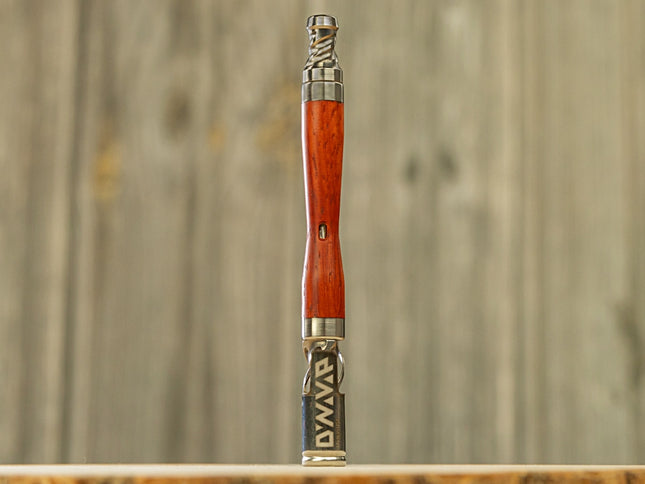 dynavap woodwynd standing vertically on wooden background