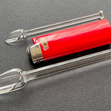 both glass scoops next to standard bic lighter