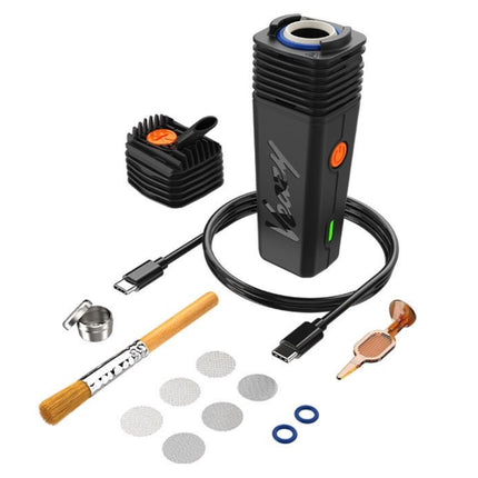 Complete VEAZY vaporizer kit by Storz & Bickel — includes device, USB-C cable, mouthpiece, screens, cleaning tools, and accessories.