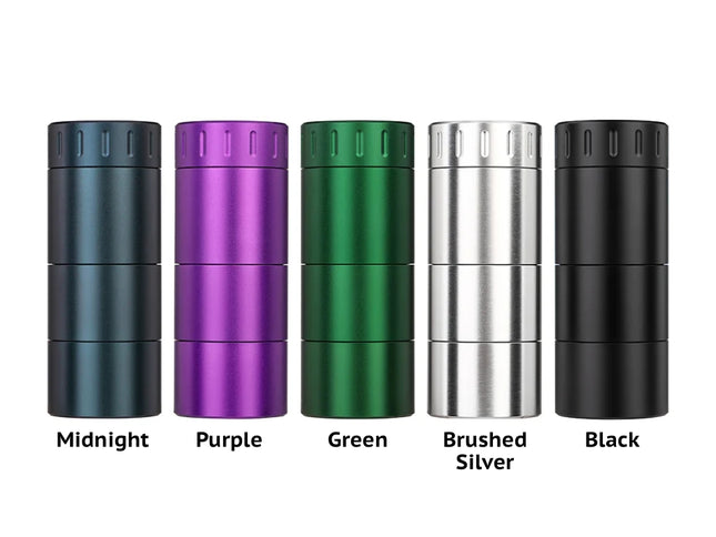 Group photo of the Mad Heaters Reload 3 in all available colours — black, midnight, silver, purple, and green — showing its compact aluminium design.